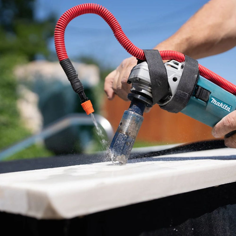 Hydrotail water system connected to grinder with diamond core bit actively flowing water for dust reduction