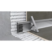 Detailed image of Gruen WallLine drain body and adjustable end cap for custom cutting and installation precision