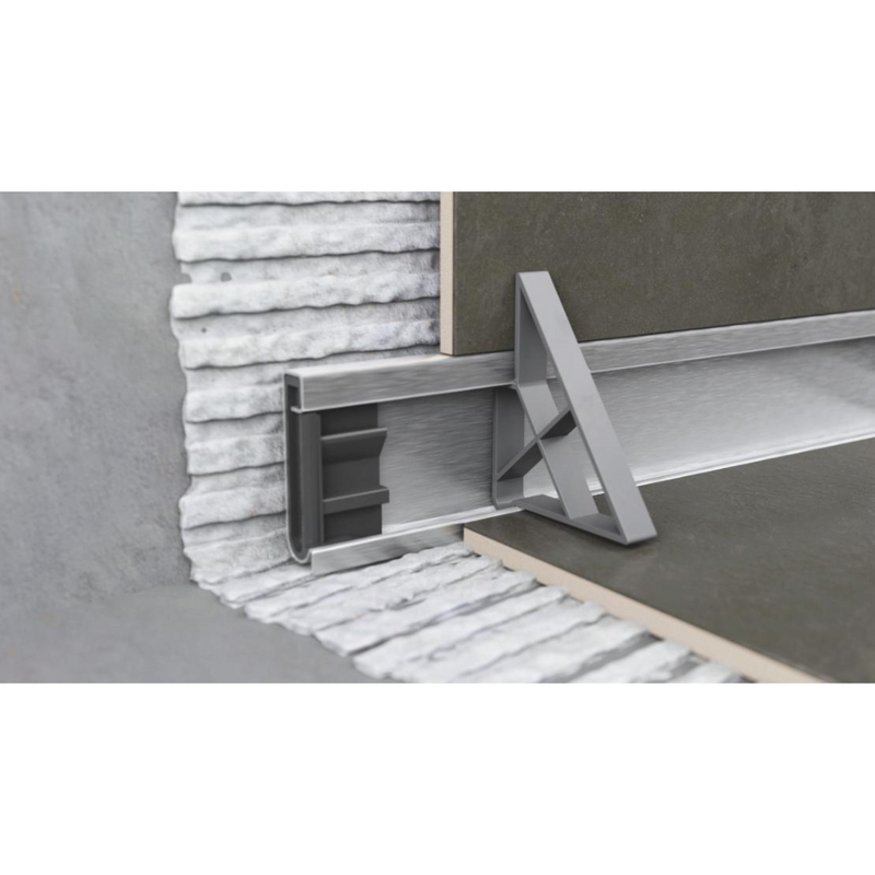 Detailed image of Gruen WallLine drain body and adjustable end cap for custom cutting and installation precision