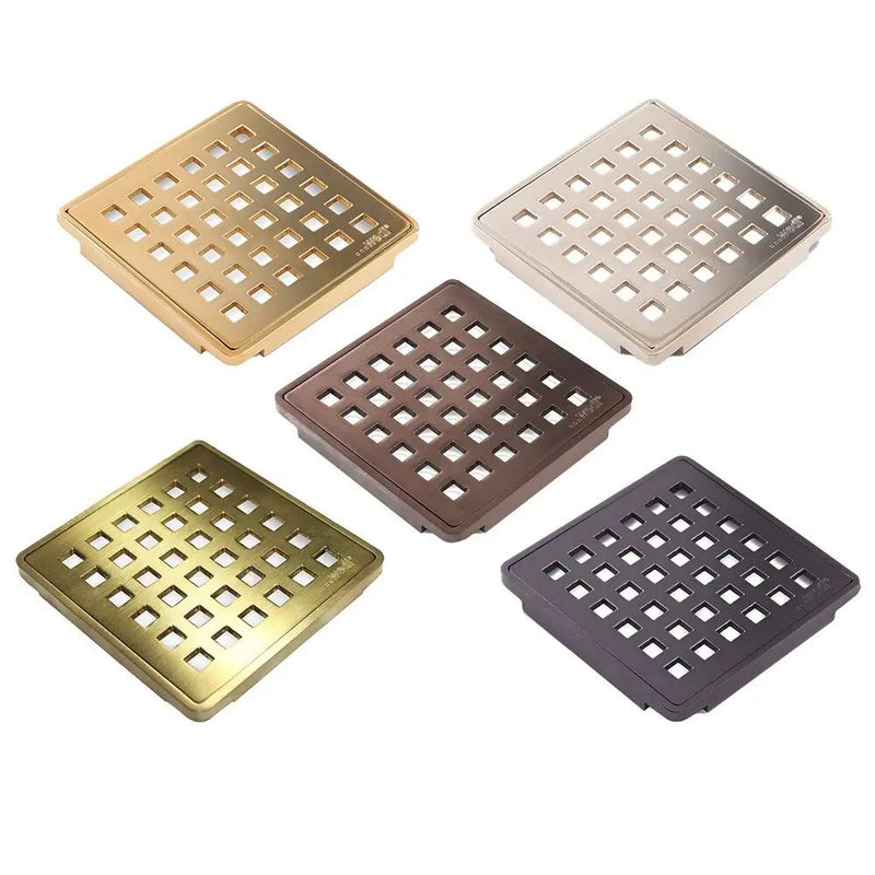 Five wedi square metal shower grates in different colors on a white background